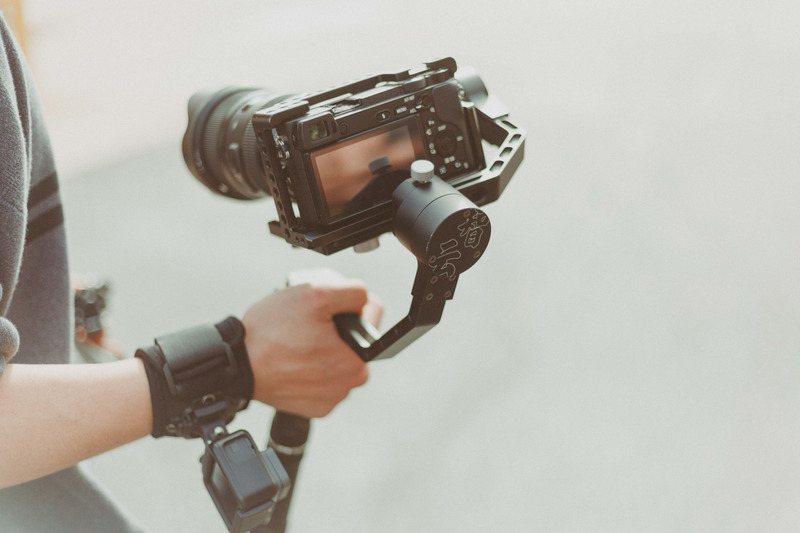 Canva-Person-Holding-Black-Dslr-Camera